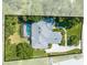 Aerial view of a single-Gathering home featuring a screened-in pool, well-maintained landscaping, and a private backyard at 2376 Nightingale Ln, Kissimmee, FL 34746