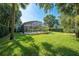 The home features a meticulously maintained lawn and manicured landscaping in the backyard at 2376 Nightingale Ln, Kissimmee, FL 34746