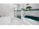 Bright bathroom with tiled shower, garden tub, and accent tile trim at 2376 Nightingale Ln, Kissimmee, FL 34746