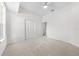 Bedroom with ceiling fan and large closet and neutral carpet at 2376 Nightingale Ln, Kissimmee, FL 34746