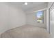 Bedroom with a ceiling fan, plush carpet, and view of the property at 2376 Nightingale Ln, Kissimmee, FL 34746