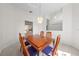 Dining room featuring contemporary lighting and views through to the backyard at 2376 Nightingale Ln, Kissimmee, FL 34746