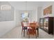 Dining room with modern chandelier and natural light from the window at 2376 Nightingale Ln, Kissimmee, FL 34746