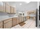Bright eat-in kitchen features tile backsplash, stainless appliances, and custom cabinetry at 2376 Nightingale Ln, Kissimmee, FL 34746