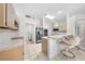 Bright kitchen with stainless appliances, tile flooring, breakfast bar, and neutral colored cabinets at 2376 Nightingale Ln, Kissimmee, FL 34746