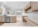 Bright kitchen featuring a breakfast bar and ample counter space with tile flooring at 2376 Nightingale Ln, Kissimmee, FL 34746