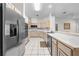 Kitchen featuring stainless steel appliances and convenient breakfast bar at 2376 Nightingale Ln, Kissimmee, FL 34746