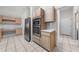 Kitchen features built-in stainless appliances and bright, airy lighting at 2376 Nightingale Ln, Kissimmee, FL 34746