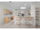 Kitchen featuring bar-style seating and a bright, open floor plan at 2376 Nightingale Ln, Kissimmee, FL 34746