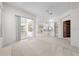 Spacious living room with an open floor plan, leading to the kitchen and patio at 2376 Nightingale Ln, Kissimmee, FL 34746