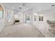 Spacious living room with fireplace, ample lighting, and easy access to outdoor pool at 2376 Nightingale Ln, Kissimmee, FL 34746