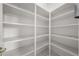 Walk-in pantry with multiple shelves for ample storage space at 2376 Nightingale Ln, Kissimmee, FL 34746