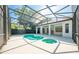 Screened-in pool and jacuzzi with covered patio provide an excellent escape to the backyard at 2376 Nightingale Ln, Kissimmee, FL 34746
