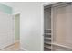 Light and airy bedroom showcases a spacious closet with sliding doors and built-in shelving system at 2416 White Poppy Dr, Kissimmee, FL 34747