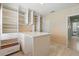Beautiful walk in closet featuring hardwood floors, a center island, and plenty of storage space at 2416 White Poppy Dr, Kissimmee, FL 34747
