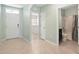 Welcoming entryway with tile floors and views of the bathroom and front door at 2416 White Poppy Dr, Kissimmee, FL 34747