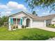 Beautiful single-story home boasts a well-maintained lawn and attached two-car garage at 2416 White Poppy Dr, Kissimmee, FL 34747