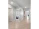 Bright hallway featuring tile floors, and an arched doorway at 2416 White Poppy Dr, Kissimmee, FL 34747