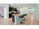 Open kitchen features granite countertops, modern appliances, and seamless access to the living areas at 2416 White Poppy Dr, Kissimmee, FL 34747