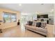 Open living space featuring a couch, kitchen island and lots of natural light at 2416 White Poppy Dr, Kissimmee, FL 34747