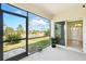 Screened patio with beautiful outdoor view and sliding glass door access to the main house at 2416 White Poppy Dr, Kissimmee, FL 34747