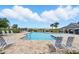 View of the community pool with sundeck, splashpad, and covered picnic area at 2416 White Poppy Dr, Kissimmee, FL 34747