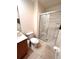 Contemporary bathroom featuring a glass-enclosed shower and toilet at 3014 Red Ginger Rd, Kissimmee, FL 34747