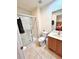 Bathroom with a tiled floor, a toilet, a vanity, and a glass-enclosed shower at 3014 Red Ginger Rd, Kissimmee, FL 34747