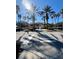 Beautiful community entrance with lush landscaping and palm trees welcoming residents and visitors at 3014 Red Ginger Rd, Kissimmee, FL 34747