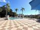Inviting community pool area with lounge chairs, perfect for relaxation and recreation in a sunny setting at 3014 Red Ginger Rd, Kissimmee, FL 34747