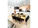 Cozy dining area with stylish table and chairs, open to the kitchen at 3014 Red Ginger Rd, Kissimmee, FL 34747