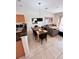Cozy dining area with stylish table and chairs, open to the living room at 3014 Red Ginger Rd, Kissimmee, FL 34747