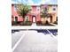 Charming townhome with colorful exterior, well-maintained landscaping, and a welcoming front entrance at 3014 Red Ginger Rd, Kissimmee, FL 34747