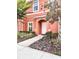 Charming two-story home with landscaped yard and inviting entrance at 3014 Red Ginger Rd, Kissimmee, FL 34747