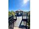 Scenic gazebo overlooking a tranquil lake, providing a serene spot for relaxation and enjoying nature at 3014 Red Ginger Rd, Kissimmee, FL 34747