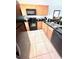 Functional kitchen featuring black appliances, granite countertops, and tile flooring at 3014 Red Ginger Rd, Kissimmee, FL 34747
