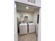 Laundry room with tile floors, washer, and dryer at 3014 Red Ginger Rd, Kissimmee, FL 34747
