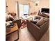 Bright living room features stylish furniture, a colorful rug, and access to the outdoor patio at 3014 Red Ginger Rd, Kissimmee, FL 34747