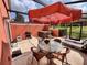 Relaxing screened-in patio area featuring a table, chairs, grill, and a hot tub for outdoor enjoyment at 3014 Red Ginger Rd, Kissimmee, FL 34747