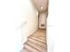 Clean staircase with wood-look steps, offering easy access between floors of the home at 3014 Red Ginger Rd, Kissimmee, FL 34747