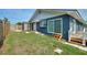 Home with a green lawn and a backyard deck at 31 Lake Link Se Cir, Winter Haven, FL 33884