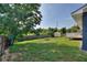 Large backyard with trees at 31 Lake Link Se Cir, Winter Haven, FL 33884
