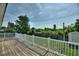 Backyard deck with white railing and yard in background at 31 Lake Link Se Cir, Winter Haven, FL 33884