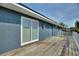 Home with a sliding glass door that opens onto a backyard deck at 31 Lake Link Se Cir, Winter Haven, FL 33884