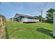 Large backyard with a deck at 31 Lake Link Se Cir, Winter Haven, FL 33884