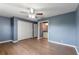 Bedroom featuring wood-look flooring, closet with folding doors, and ensuite bathroom at 31 Lake Link Se Cir, Winter Haven, FL 33884