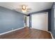 Bedroom featuring wood-look flooring, a closet with folding doors, and a window at 31 Lake Link Se Cir, Winter Haven, FL 33884