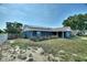 Home with blue exterior paint and a solar panels on the roof at 31 Lake Link Se Cir, Winter Haven, FL 33884
