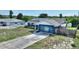 Charming exterior view of home with blue paint and solar panels on roof at 31 Lake Link Se Cir, Winter Haven, FL 33884