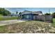 Home with a blue exterior and a driveway in front at 31 Lake Link Se Cir, Winter Haven, FL 33884